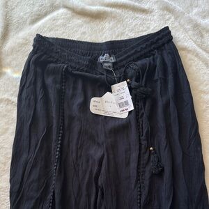 Angie Black Tassel Trim Pants NWT opens leg in front perfect for summer or beach